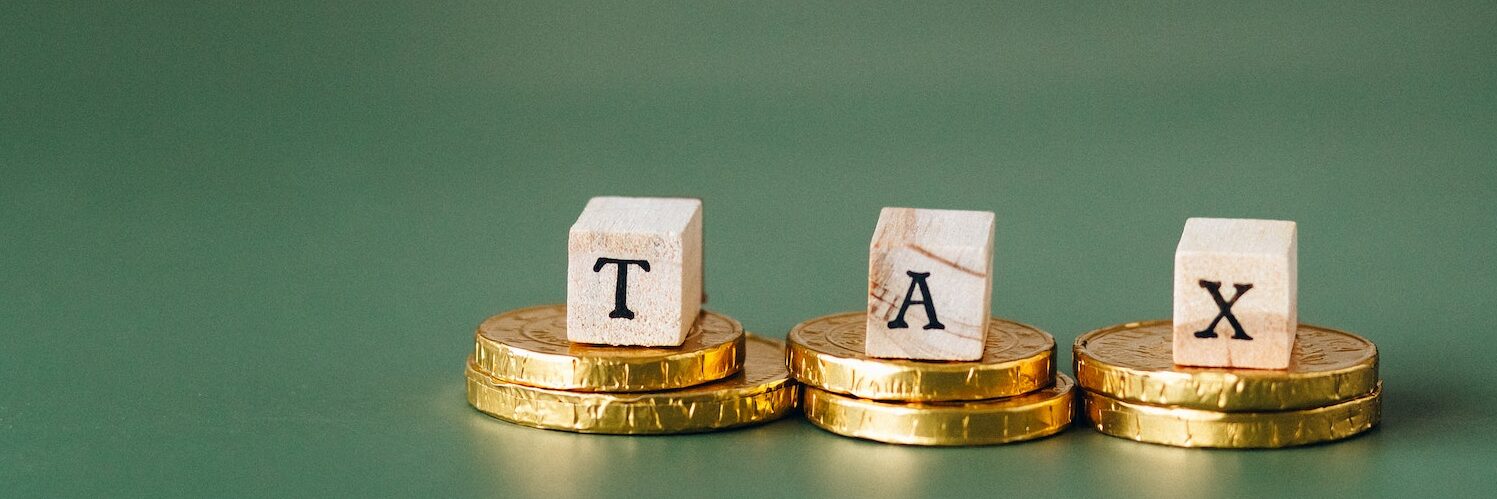 Tax letters and gold coins - commercial real estate