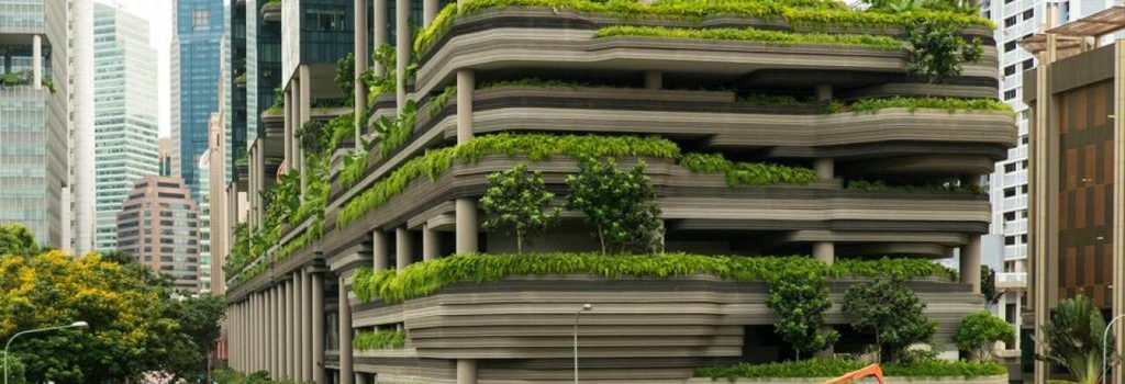 A futuristic city with green buildings and renewable energy sources, representing the potential of green building in the future.
